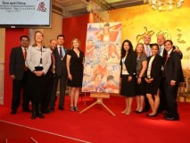 The OBE team posing with Greg’s painting