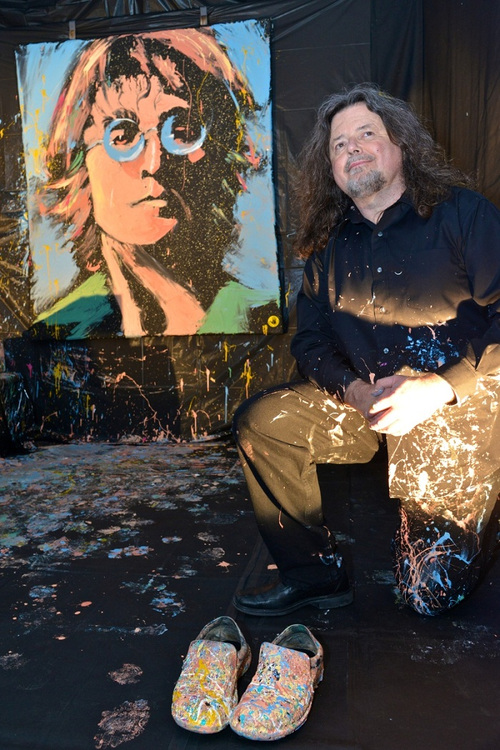 Greg Adamson next to his John Lennon painting